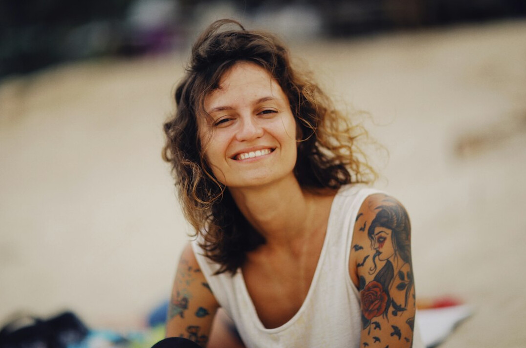 Portrait of a smiling woman with curly hair