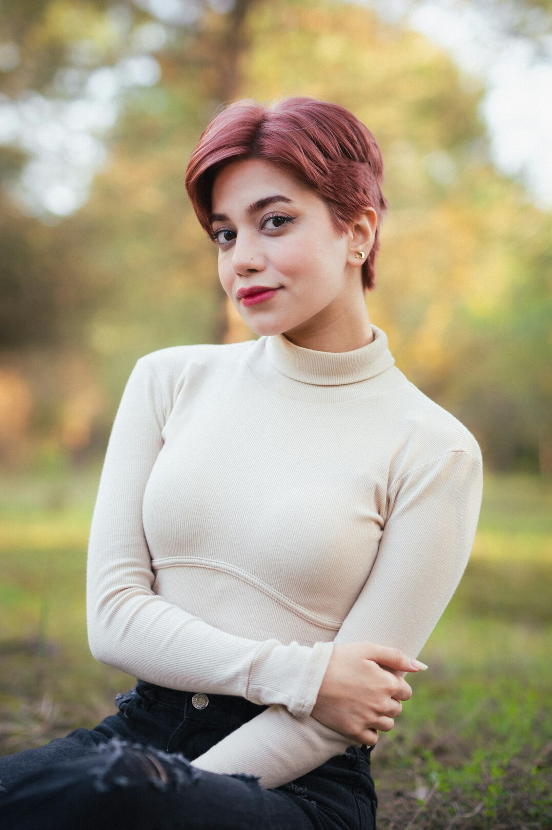 Portrait of a woman with short hair outdoors