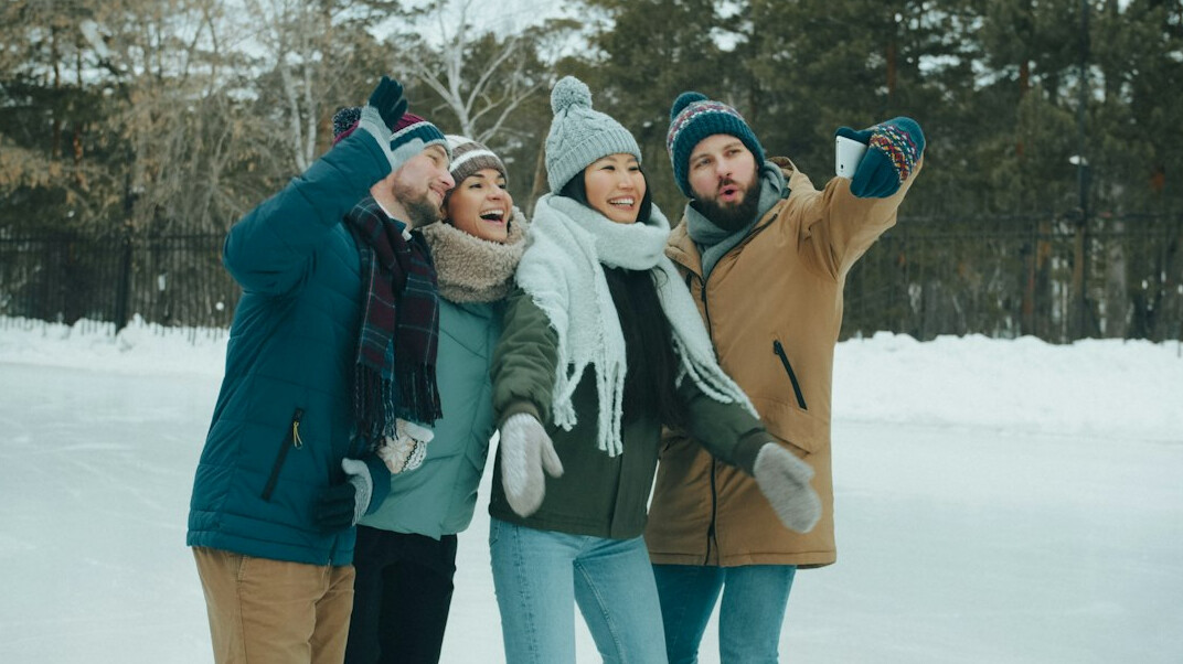 Group of friends laughing together outdoors