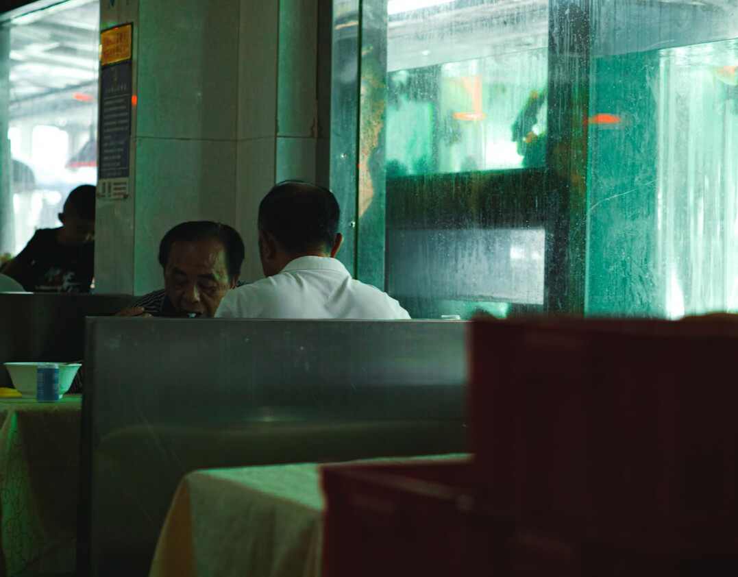 Two people having a conversation at a table
